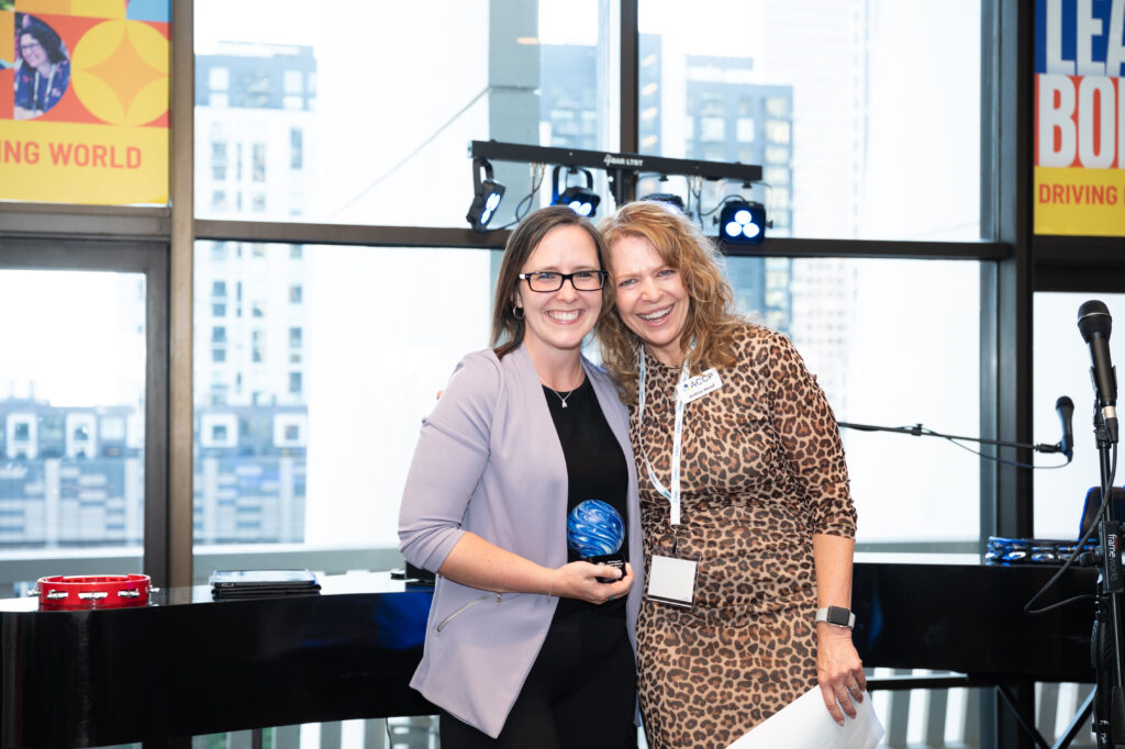 Danielle Nickerson from Toyota Material Handling receiving 2025 Rising Star Purpose Award from ACCP CEO Andrea Wood.